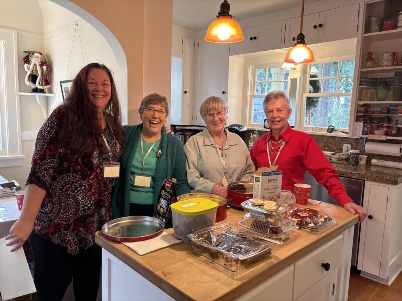 volunteers at holiday tea for senior community
